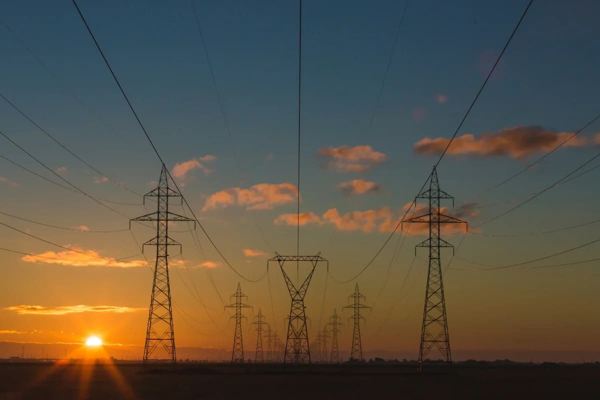 Symbolic image for AI risks in critical infrastructure — power grid and digital systems.