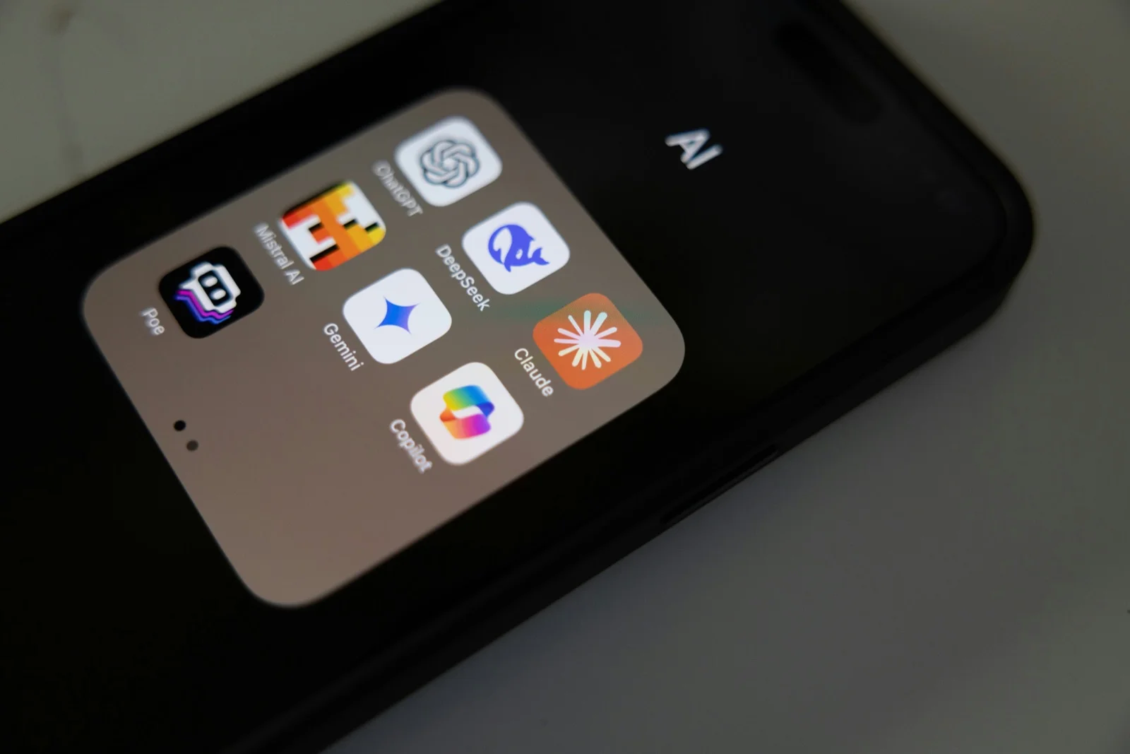 Smartphone displaying AI apps including Claude by Anthropic.